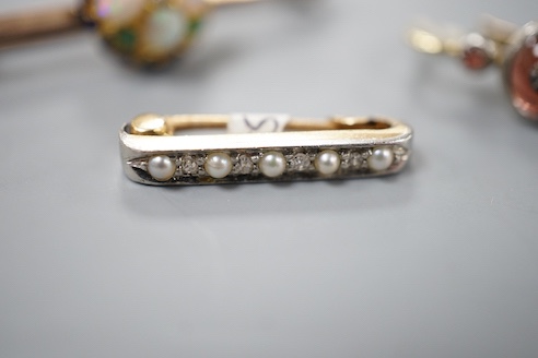 A small Edwardian yellow metal, diamond chip and seed pearl set bar brooch, 20mm, one other gem set bar brooch(adapted) and a single gem set earring, gross 6.1 grams.